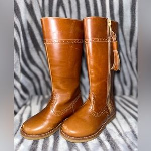 Little girl riding boots